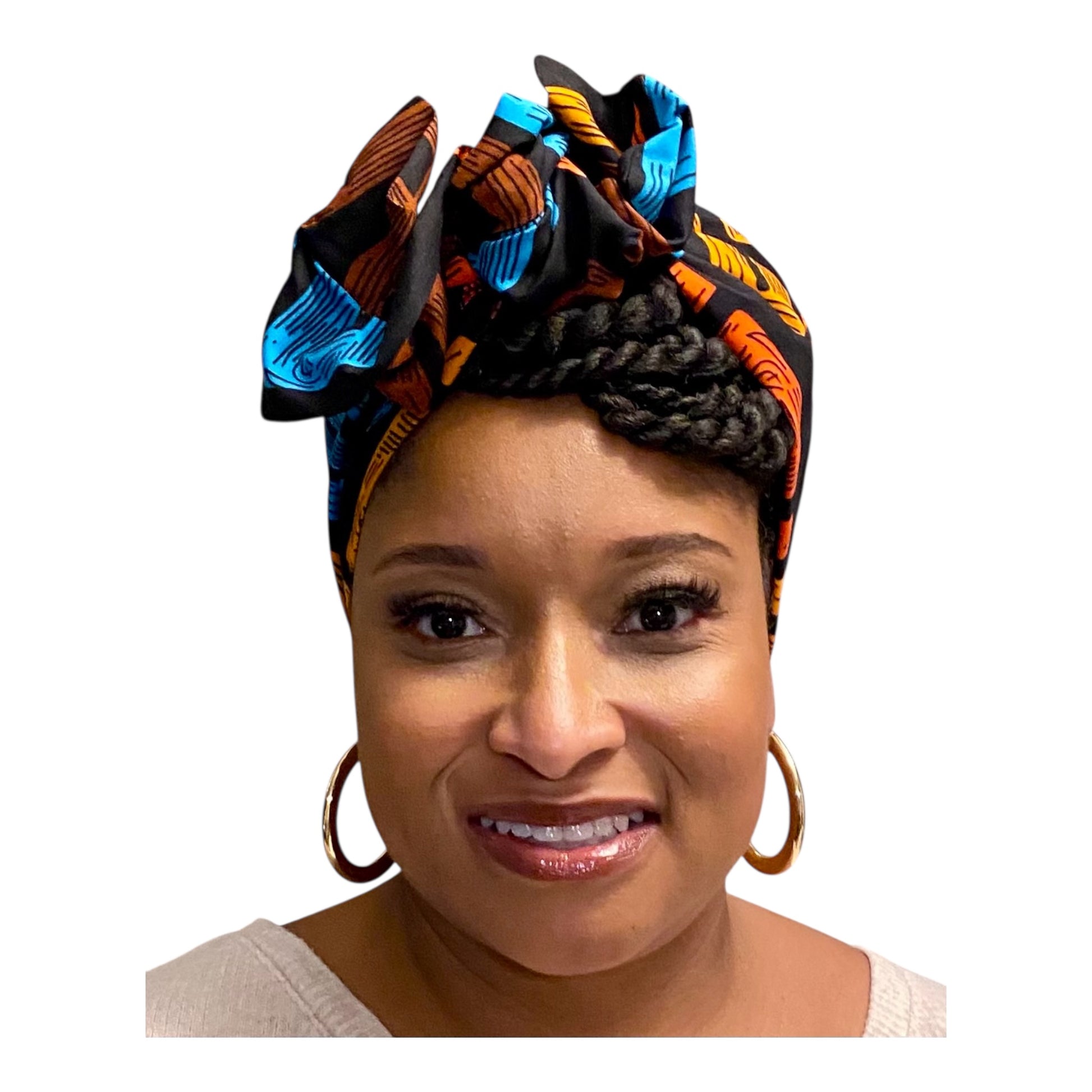 Woman wearing a colorful headwrap on a white background