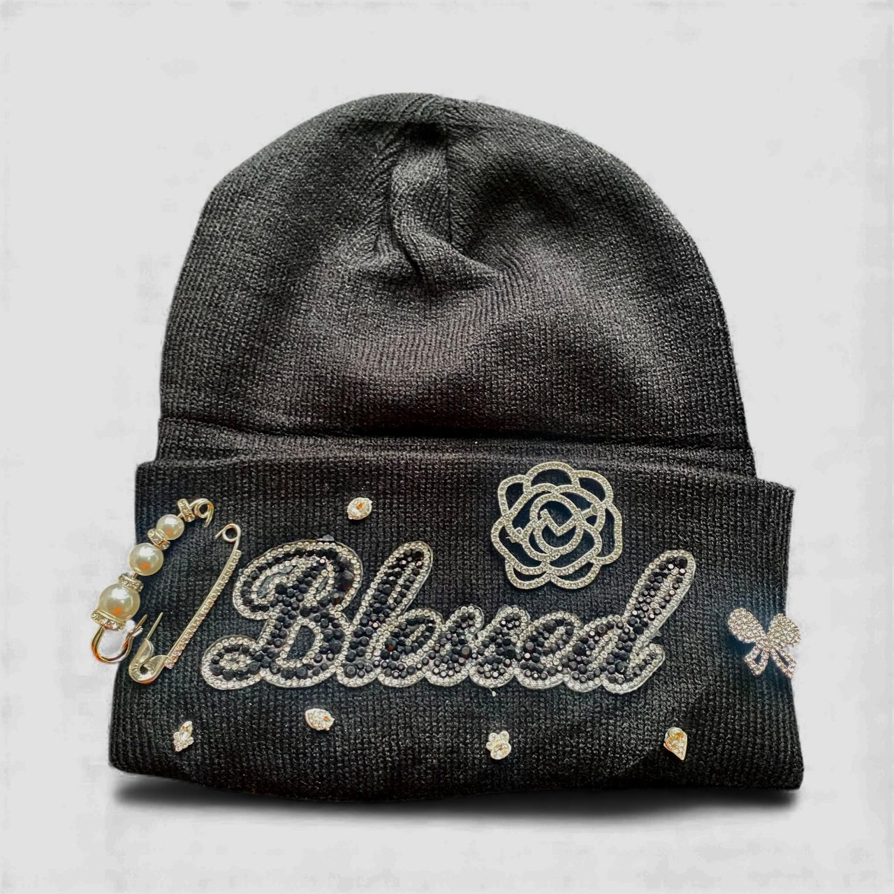 Black with 'Blessed' text and decorative elements on a light gray background