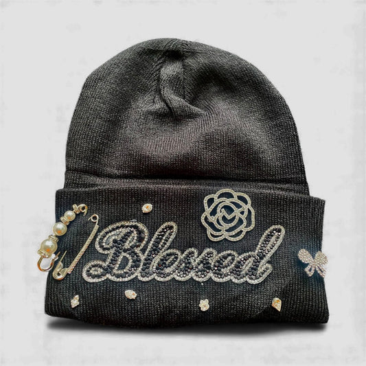 Black with 'Blessed' text and decorative elements on a light gray background