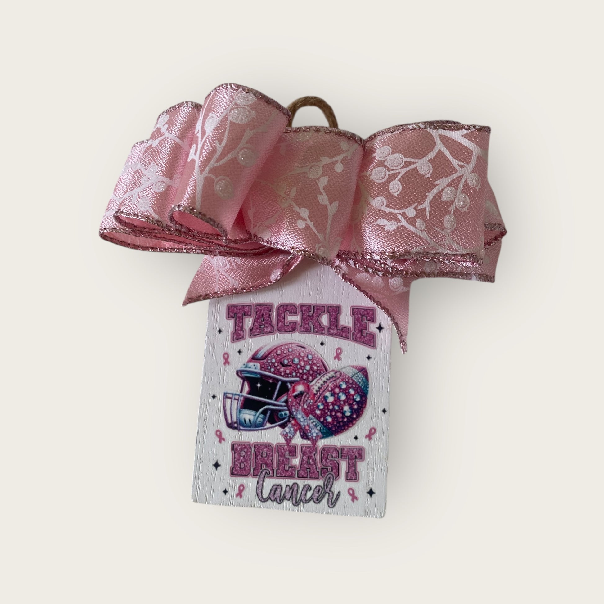 Pink ribbon with a breast cancer awareness message on a white background